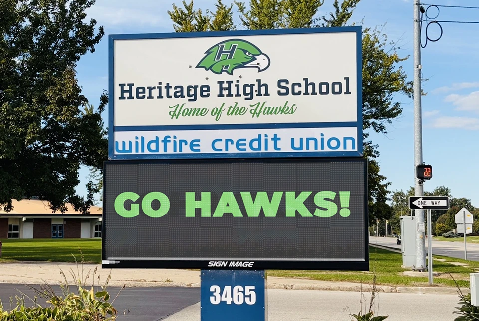 New digital sign at Heritage High School with Wildfire Credit Union as a sponsor on it.