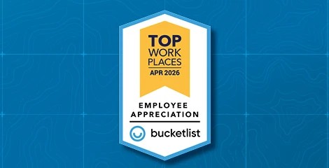 Badge on blue topo grid background showing Wildfire as top work places in April 2026.