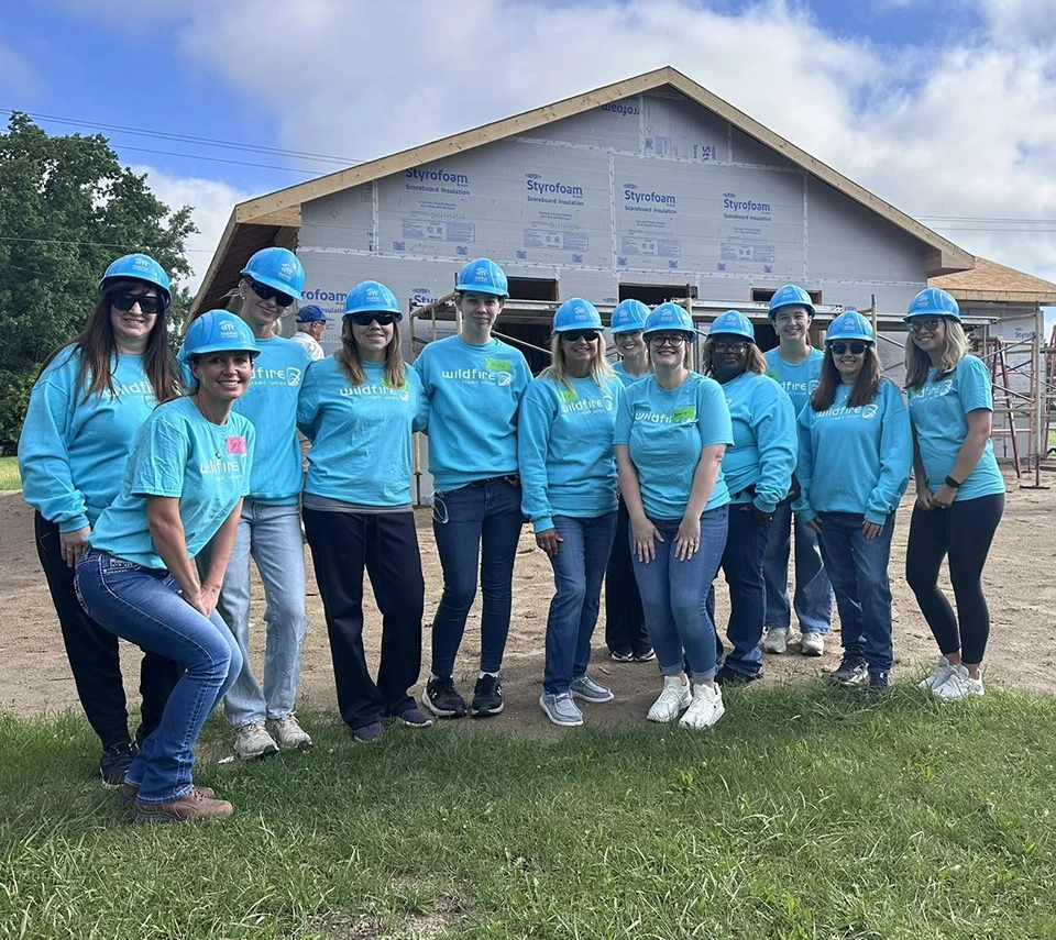 Wildfire's women employees spent the day in Midland building with Habitat for Humanity.