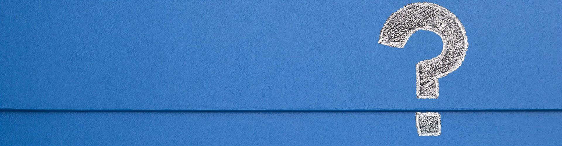 White Question mark on royal blue backdrop White Question mark on royal blue backdrop