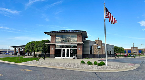 Wildfire Bay City Branch with the American Flag on a sunny day