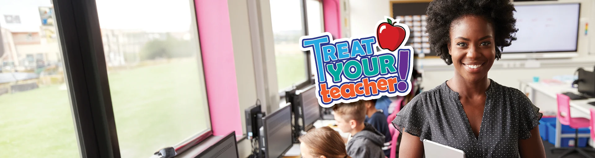 A smiling teacher in her classroom