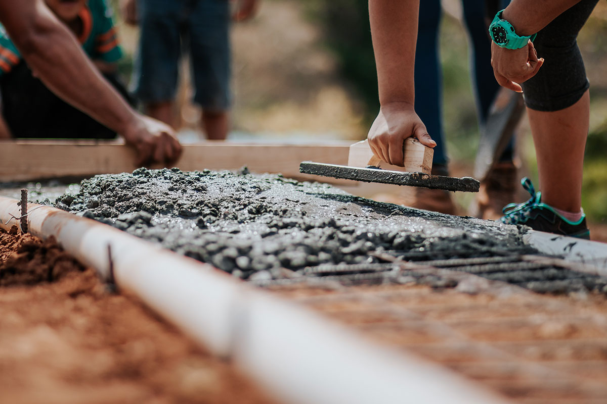 Volunteer workers building a house