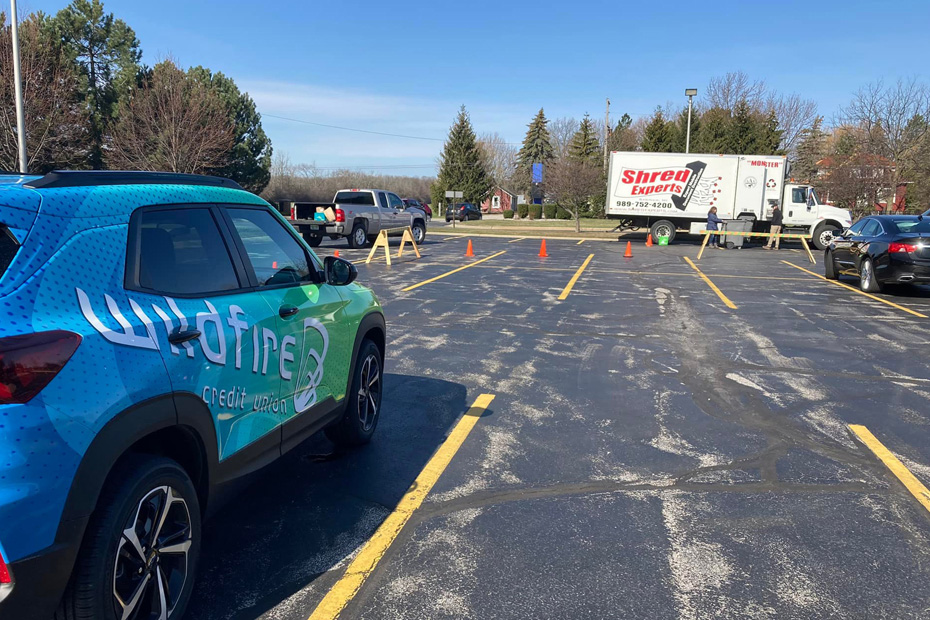 Wildfire branded car near paper shredding truck