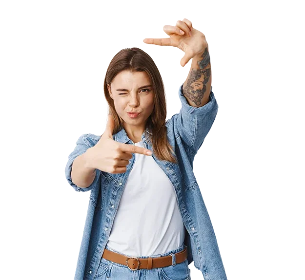 Girl in jean jacket holding hands together.