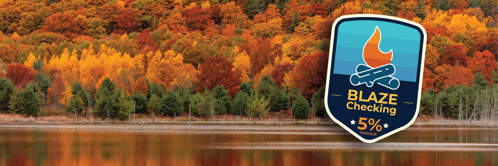 Blaze Checking badge with an array of fall trees on the edge of a Michigan lake.