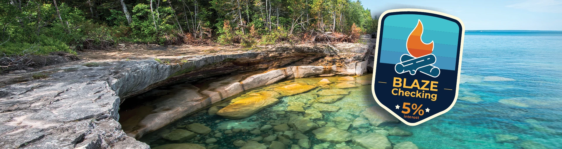Blaze Checking logo on top of Pictured Rocks on Lake Superior.
