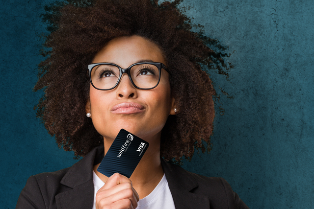 Business Loans credit card Woman with a credit card looking on confidently