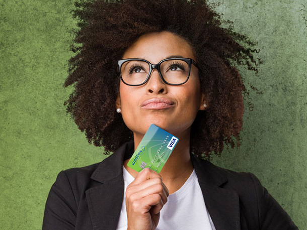 confident female business employee holding Wildfire Credit Card confident female business employee holding Wildfire Credit Card