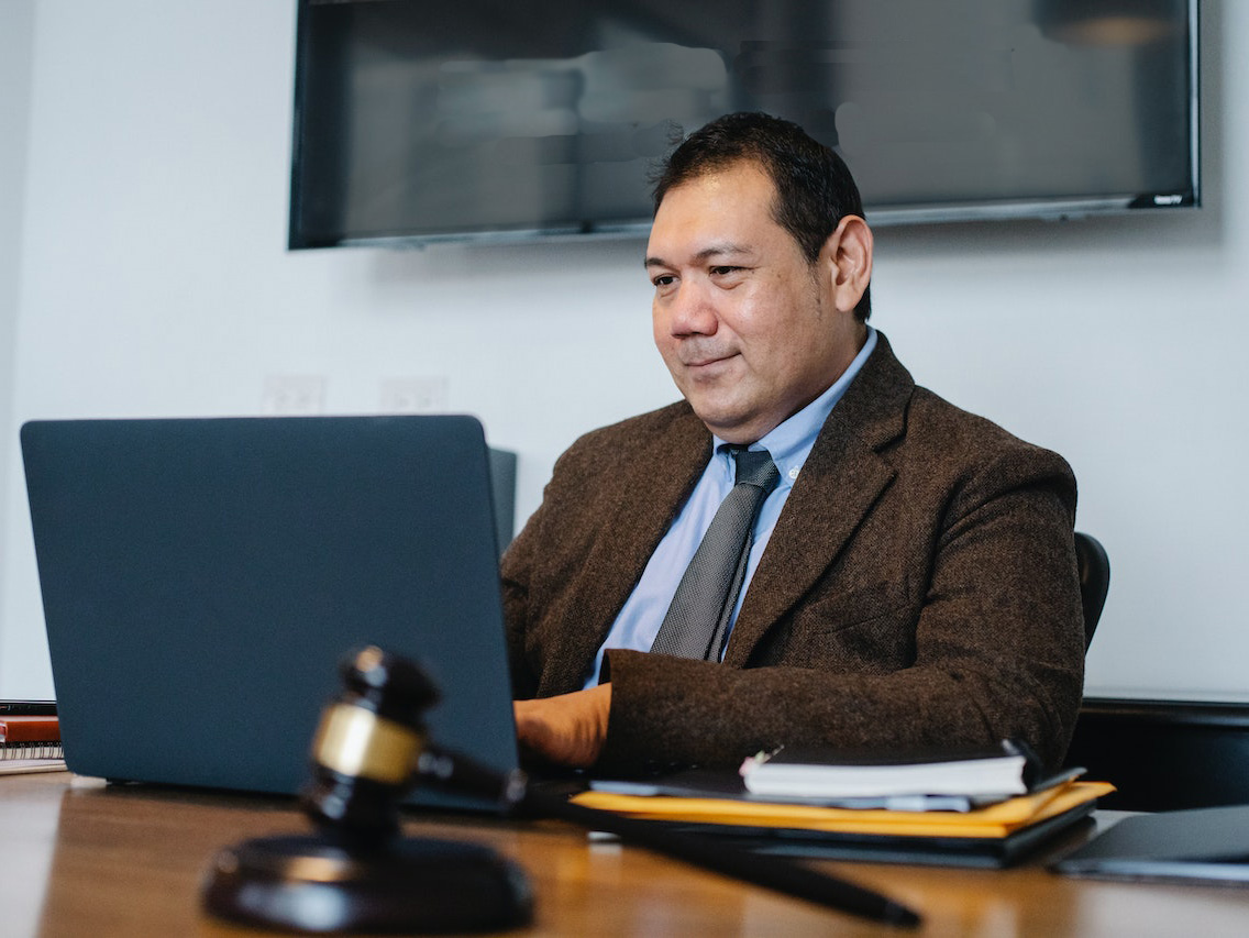 middle aged lawyer working on laptop in office middle aged lawyer working on laptop in office