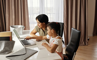 Mother and daughter at computer