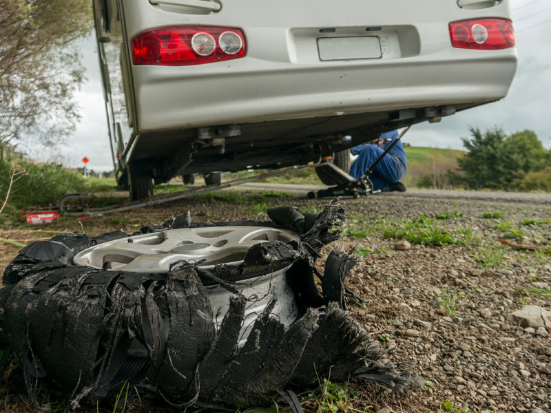 Man repairing an RV wheel