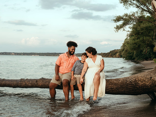 Family sitting on island beach