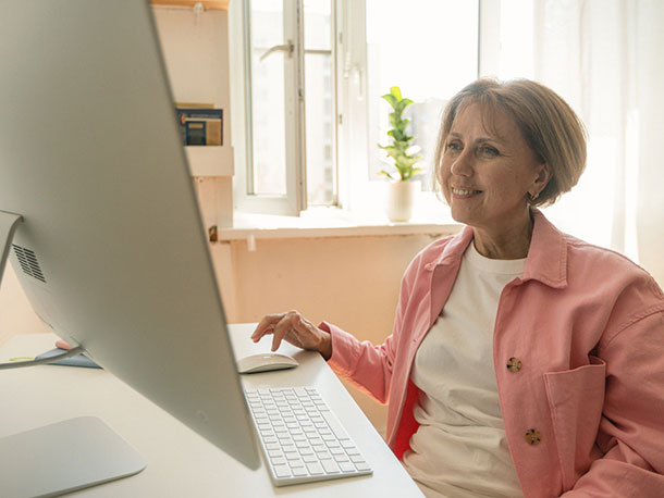 Senior woman using a desktop computer Senior woman using a desktop computer