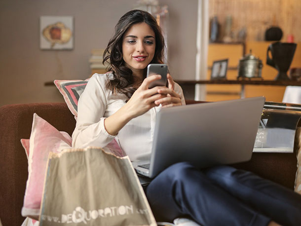 Woman Using Her Smartphone and Computer Woman Using Her Smartphone and Computer