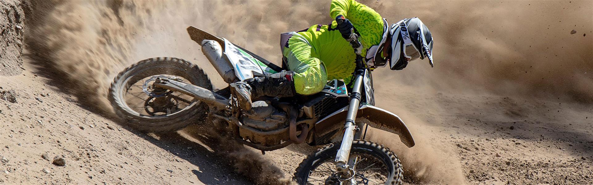 Person riding dirt bike Person riding a dirt bike