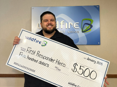 Joshua Stanard Joshua Stanard smiling and holding a check for 500 dollars
